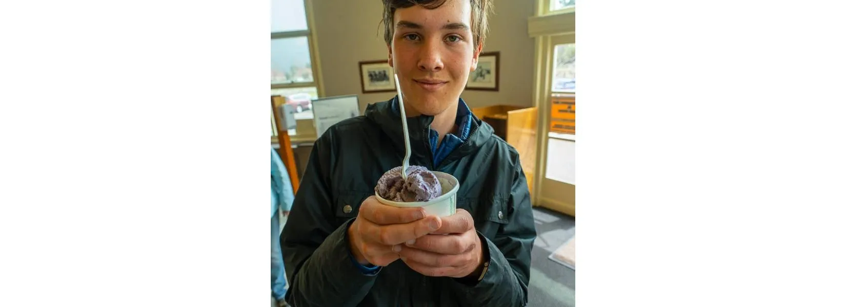 Hiker enjoying ice cream at Mammoth Grill after a day of exploring Yellowstone trails